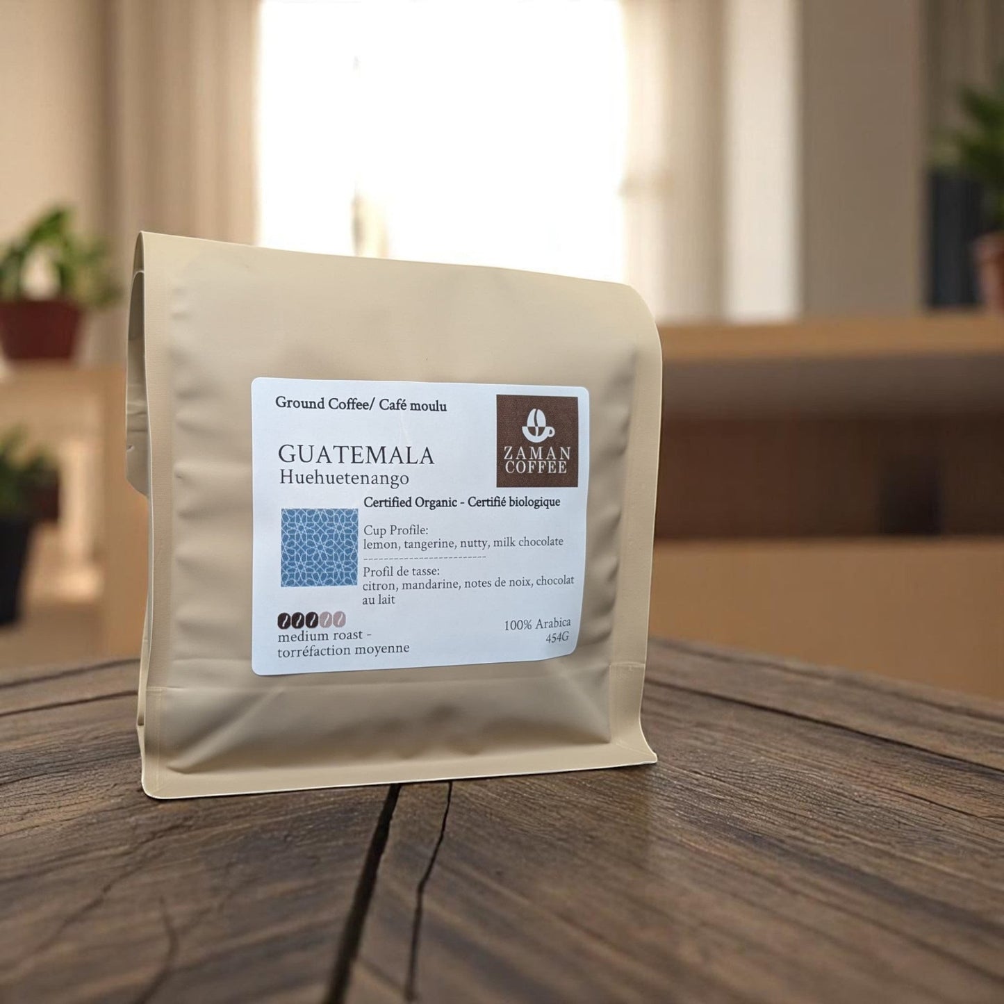 ZAMAN COFFEE Guatemala Huehuetenango organic medium roast coffee bag on a wooden table