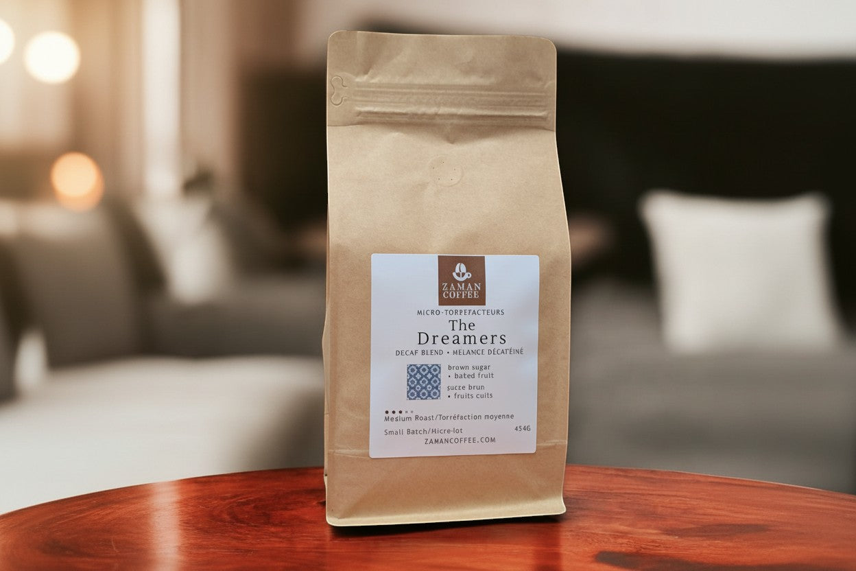 ZAMAN COFFEE The Dreamers decaf blend in a brown paper bag with notes of brown sugar and baked fruit.