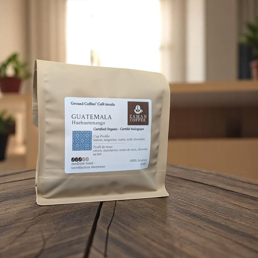 ZAMAN COFFEE Guatemala Huehuetenango organic medium roast coffee bag on a wooden table